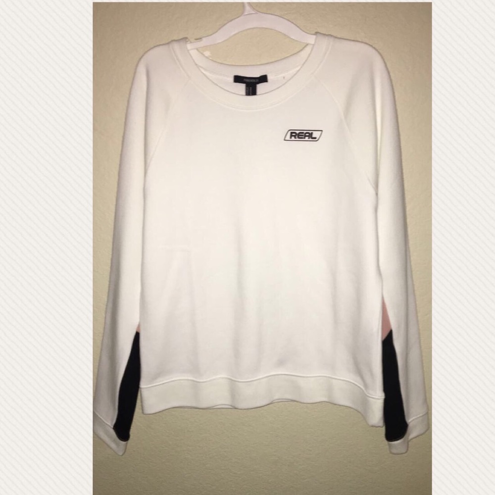 white, pink, and black sweat shirt with a graphic